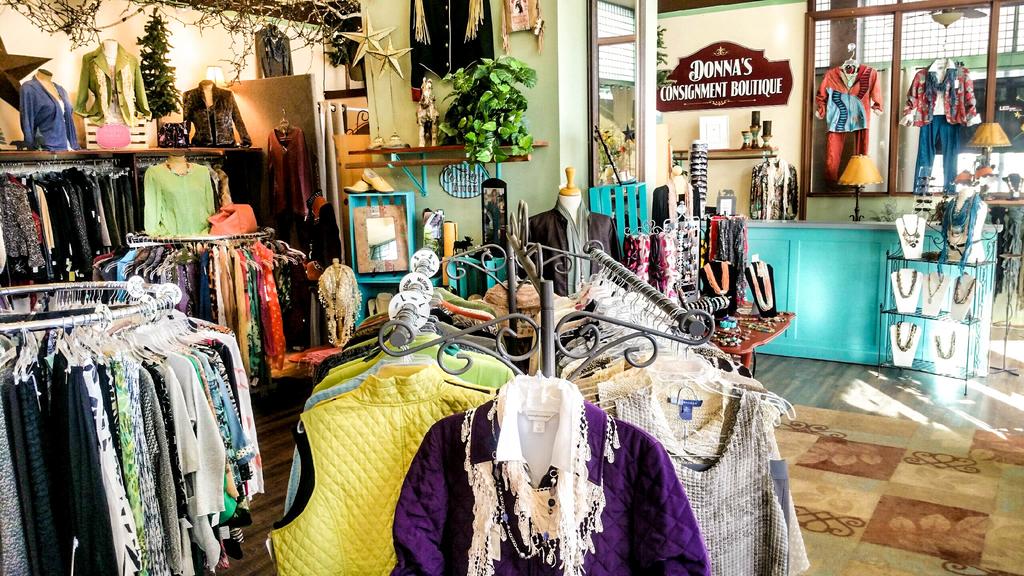Colorful clothing and accessories displayed in Donna's Consignment Boutique, showcasing a welcoming retail space for fashion enthusiasts.